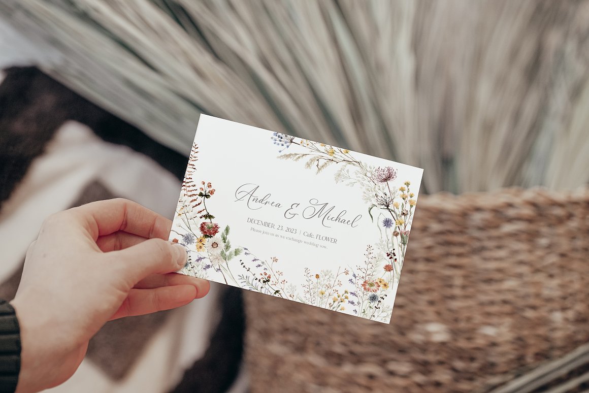White wedding card with floral illustrations and black lettering.