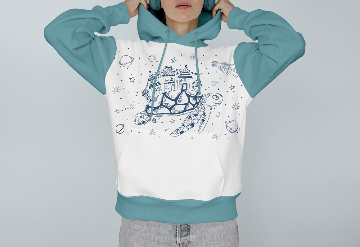 Girl in white and blue sweatshirt with illustration of sea animal.