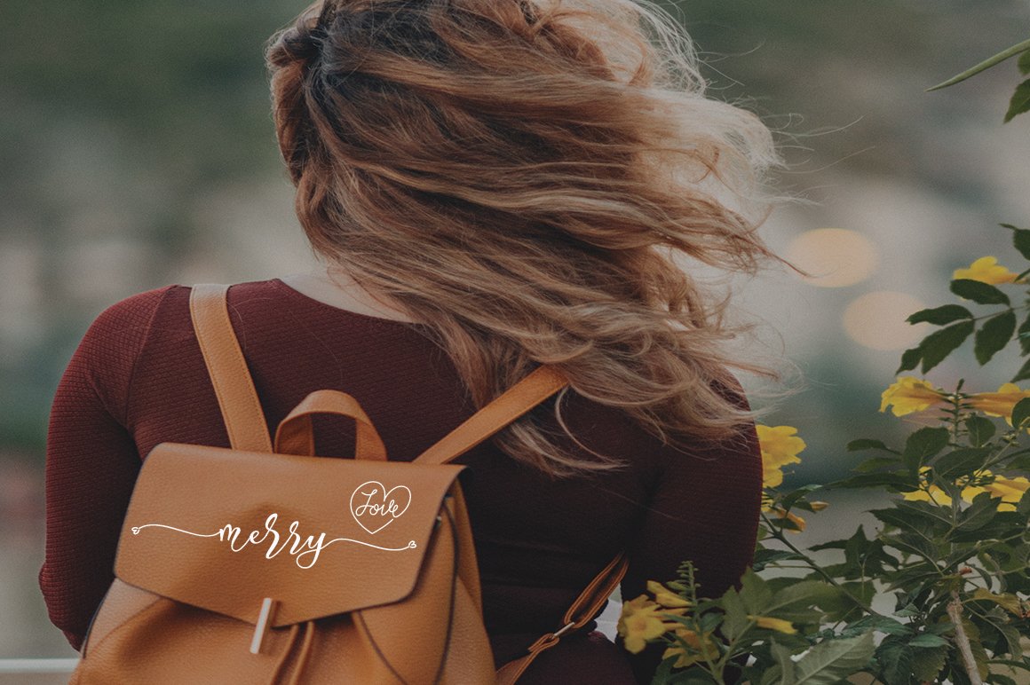 Brown backpack with white calligraphy lettering "Merry".