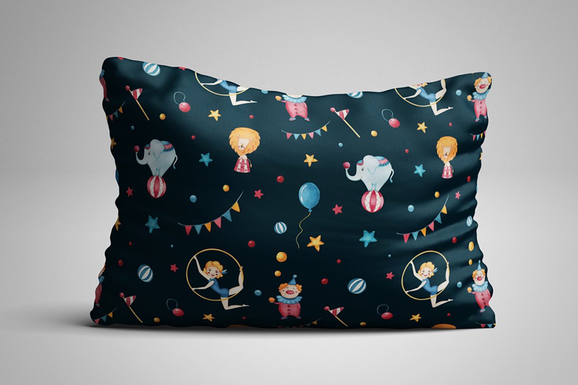 Black pillow with seamless patterns of circus on a gray background.