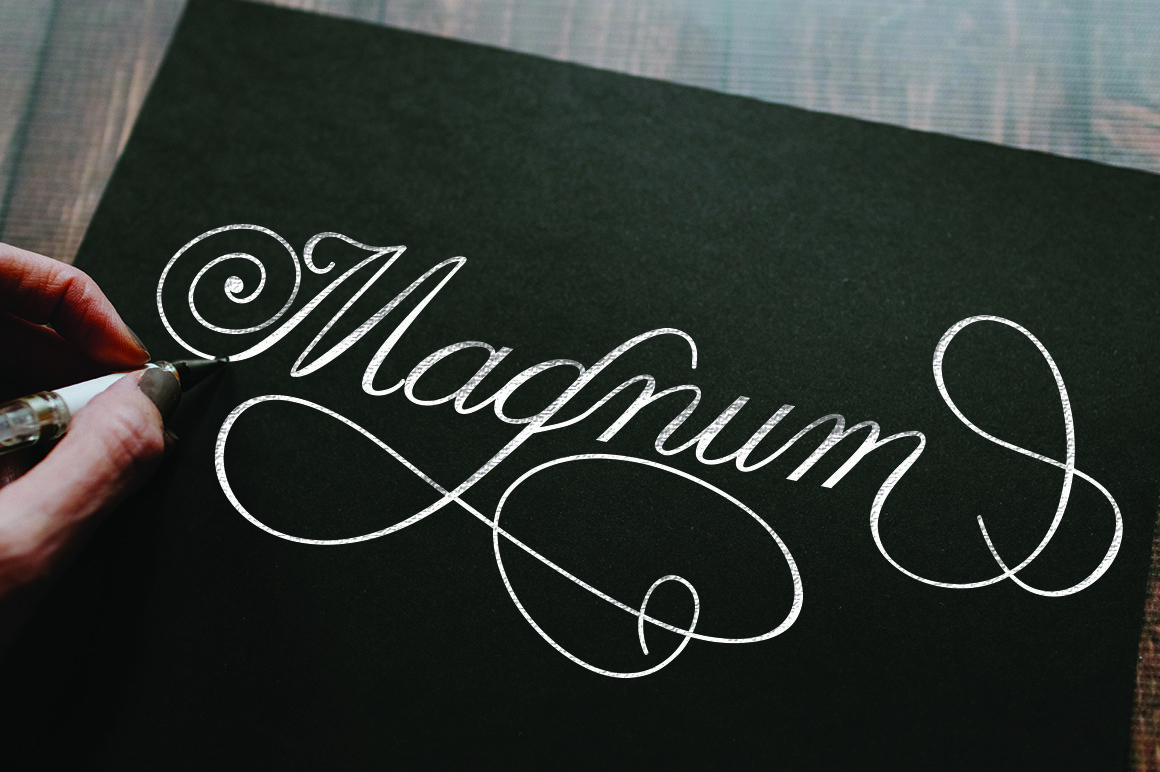 Black card with white calligraphy lettering "Magnum".