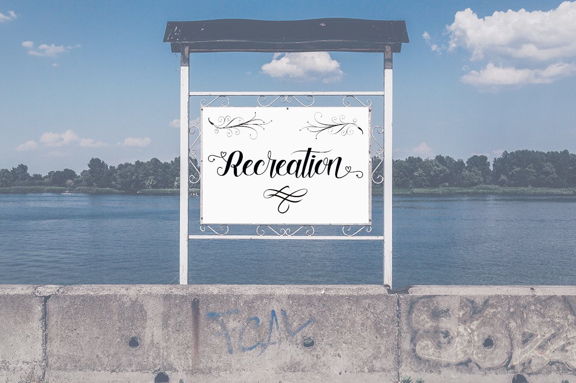 White standboard with black calligraphy lettering "Recreation".