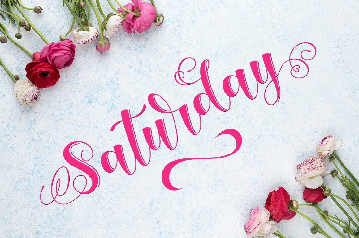 Pink calligraphy lettering "Saturday" on a gray background with flowers.