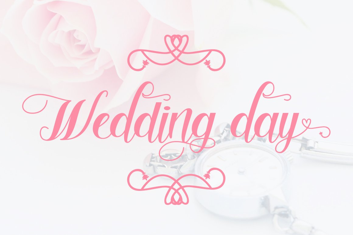 Pink "Wedding day" calligraphy lettering.