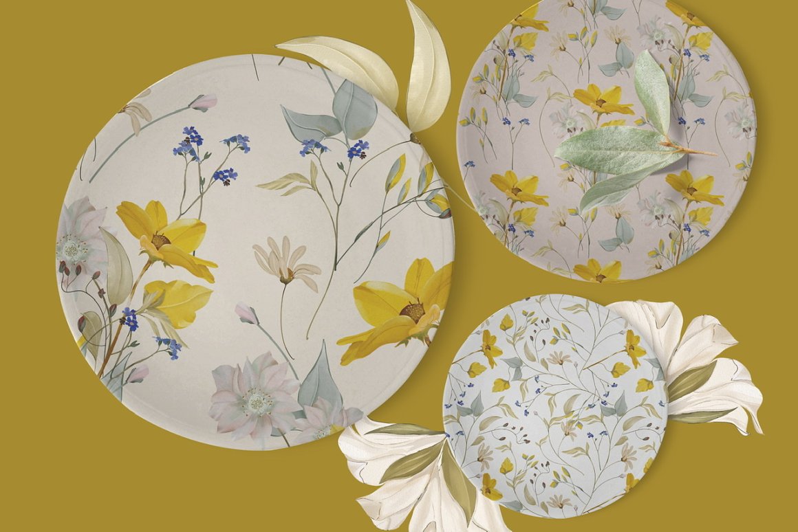 3 white plates in different sizes with meadow flowers patterns.