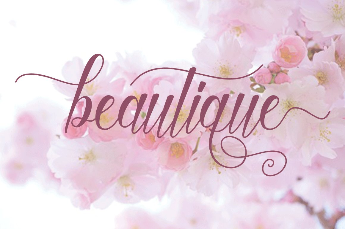 Dirty pink calligraphy lettering "beautique" on the flowers background.