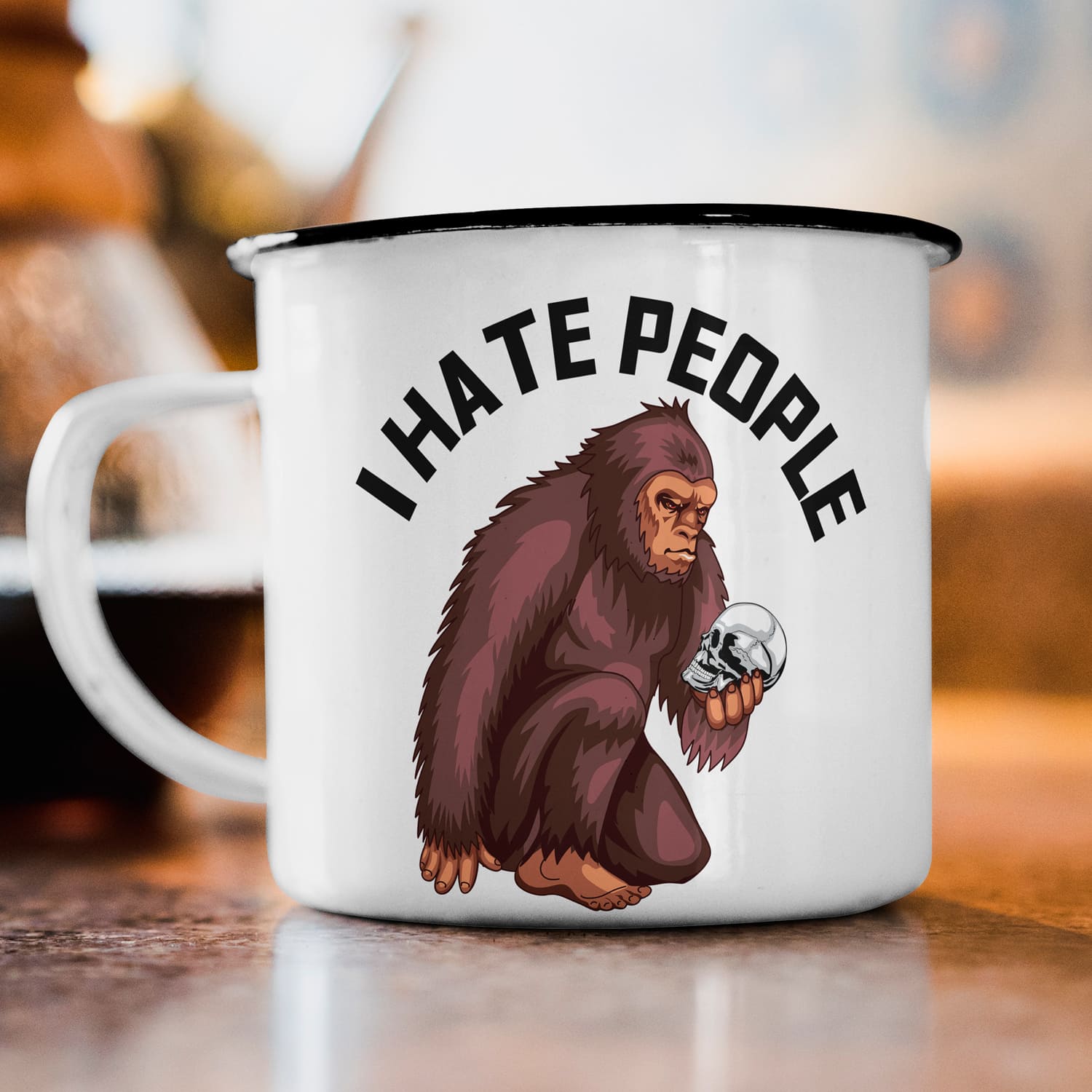 White and black coffee mug with a picture of a monkey on it.
