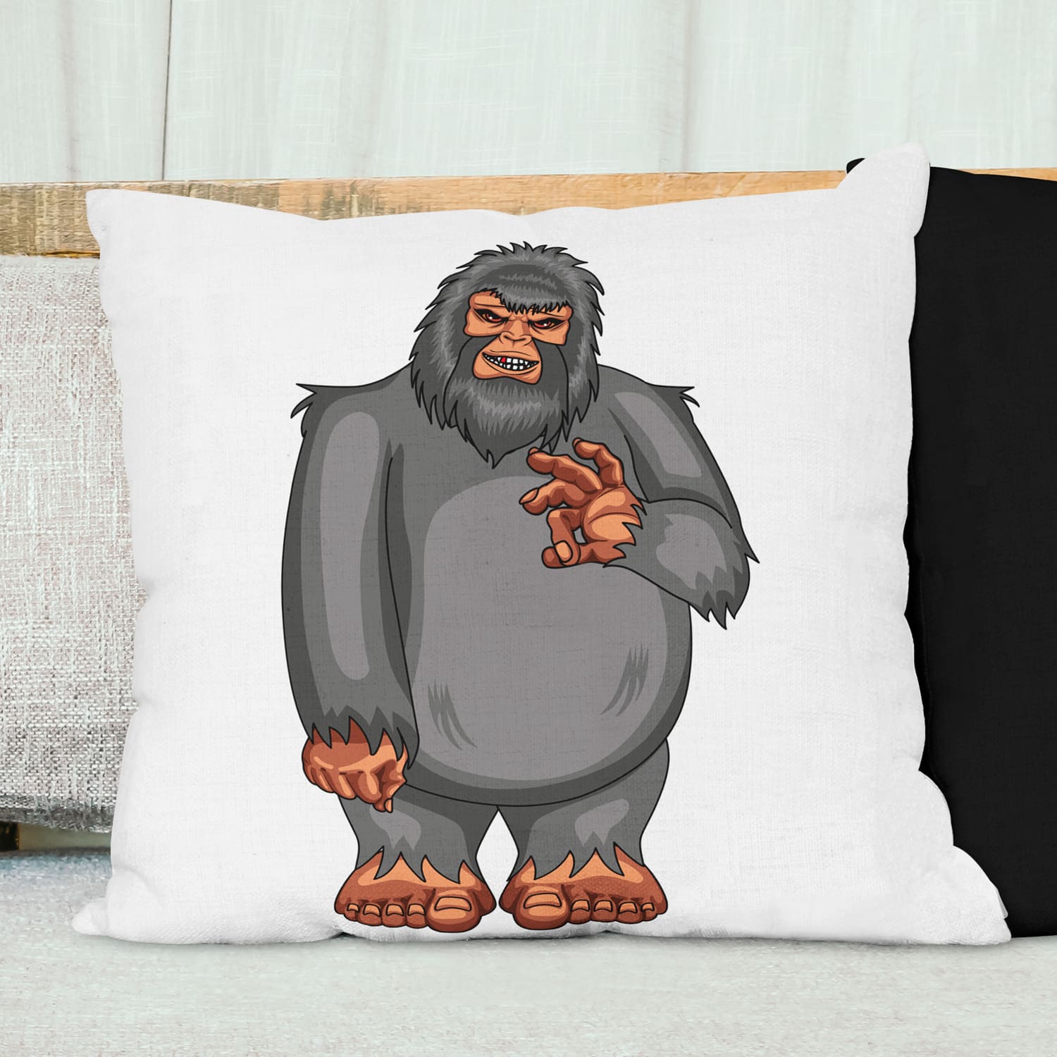Pillow with a cartoon gorilla on it.