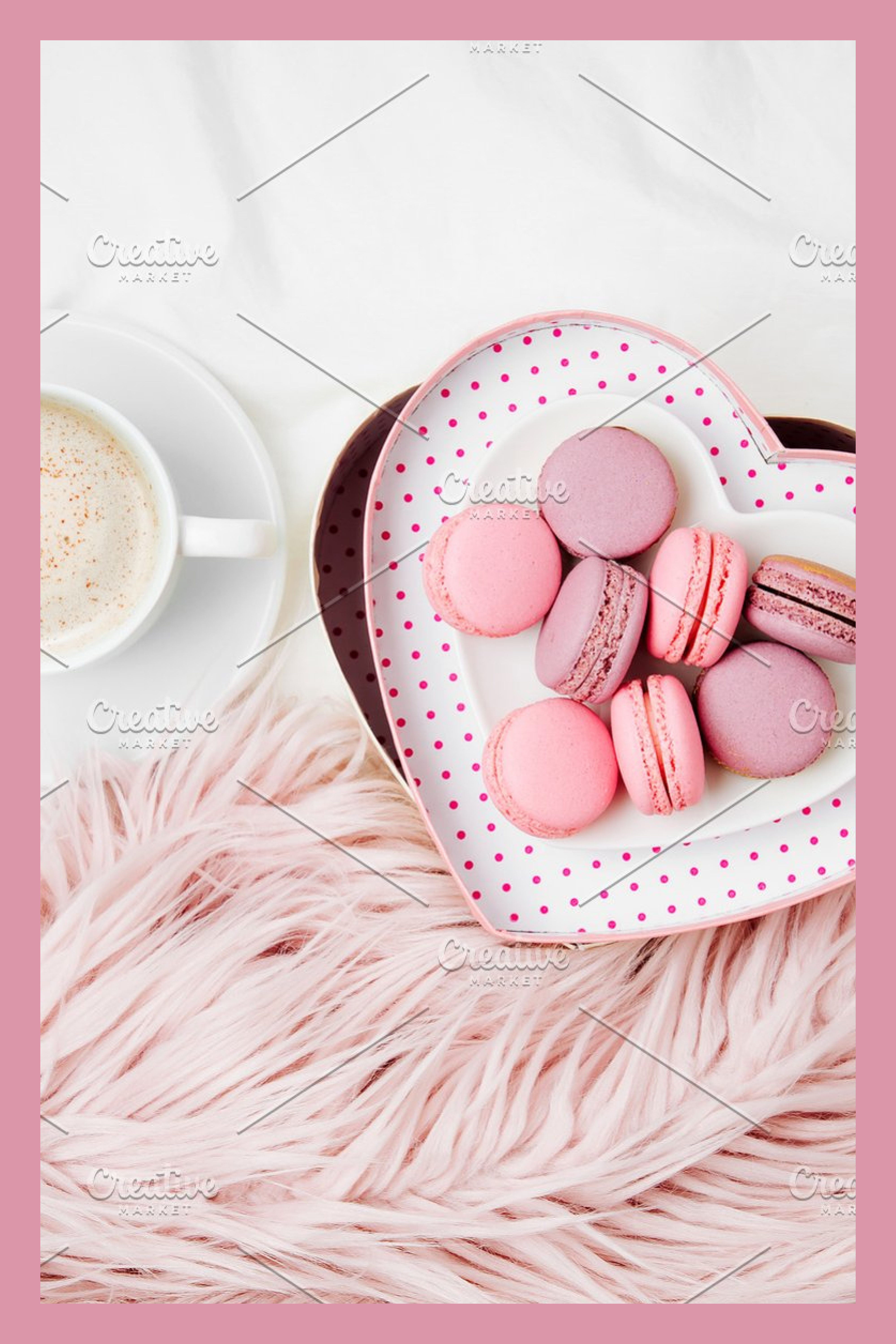 A cup of cappuccino or cocoa combined with a heart-shaped box full of macaroons.