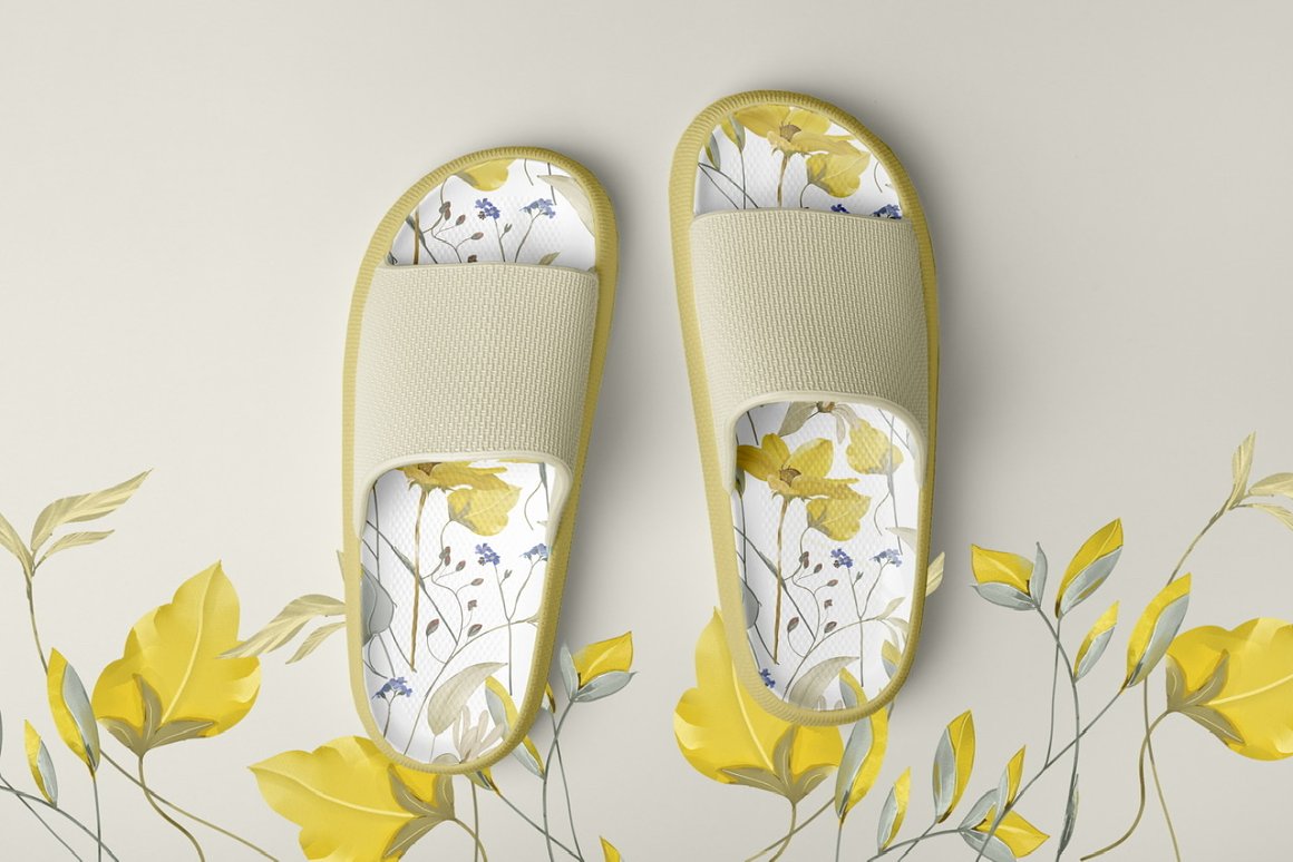 Slippers with meadow flowers patterns on a gray background.