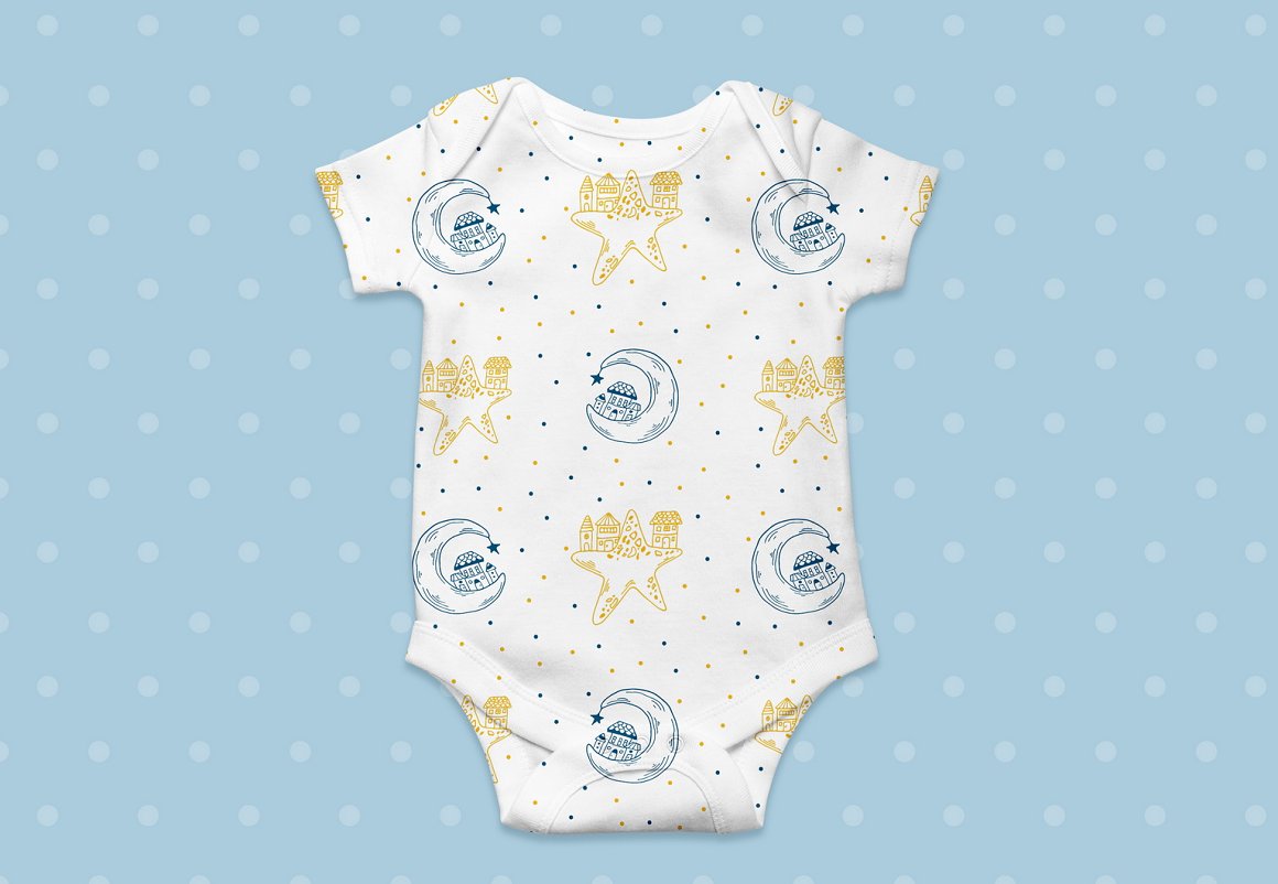 White baby bodysuit with galaxy and sea illustrations on a blue dotted background.