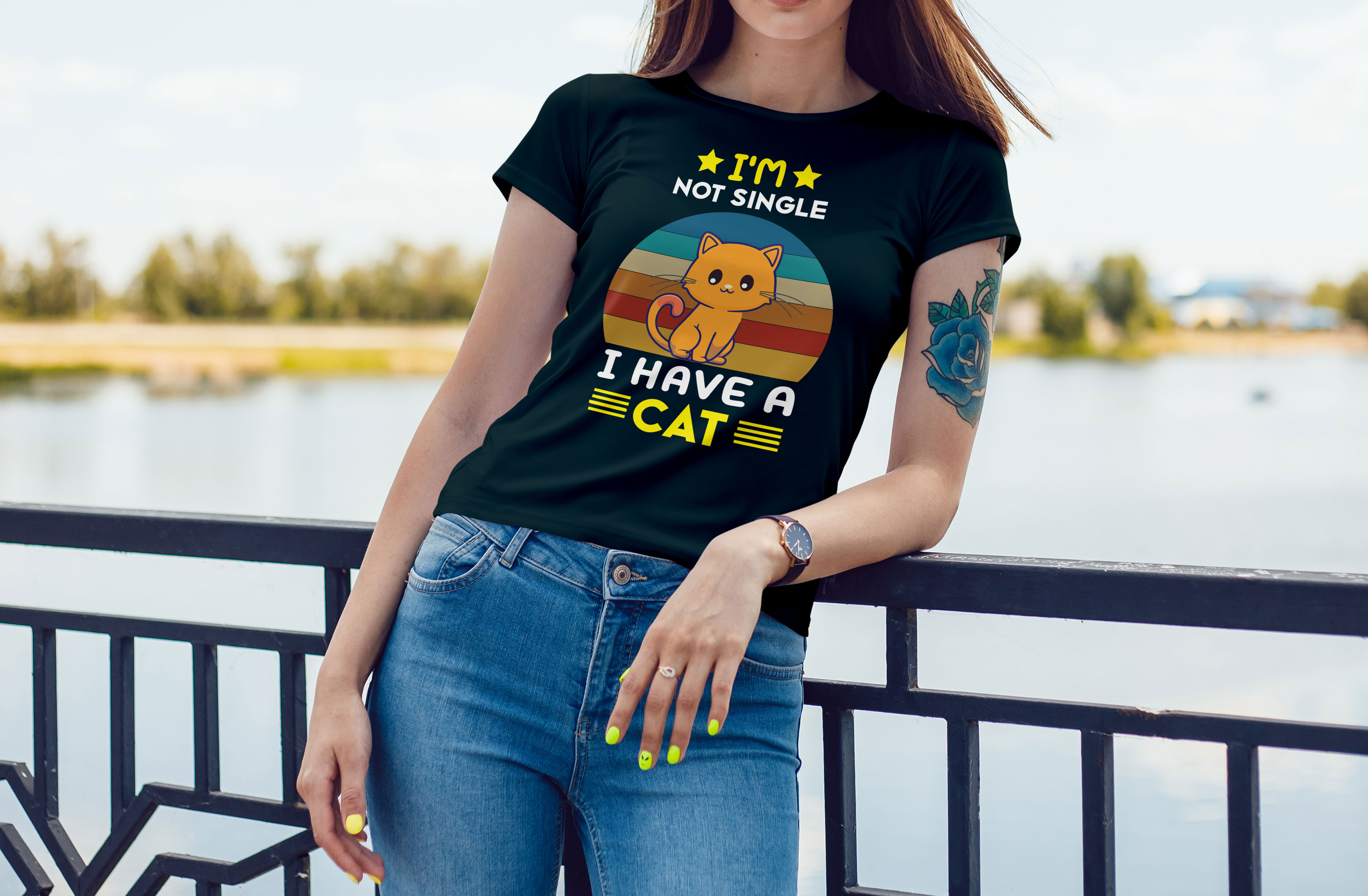 Image of a black t-shirt with an adorable print with a cat