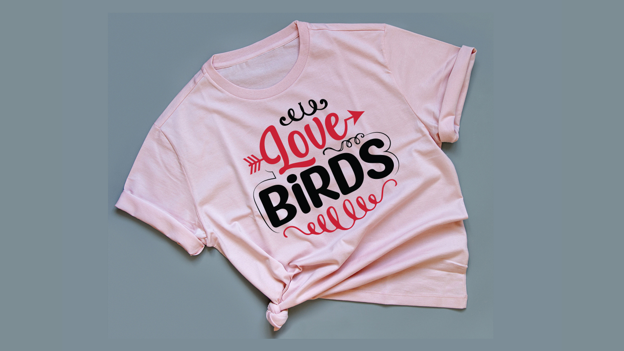 Light pink t-shirt with bicolor lettering.