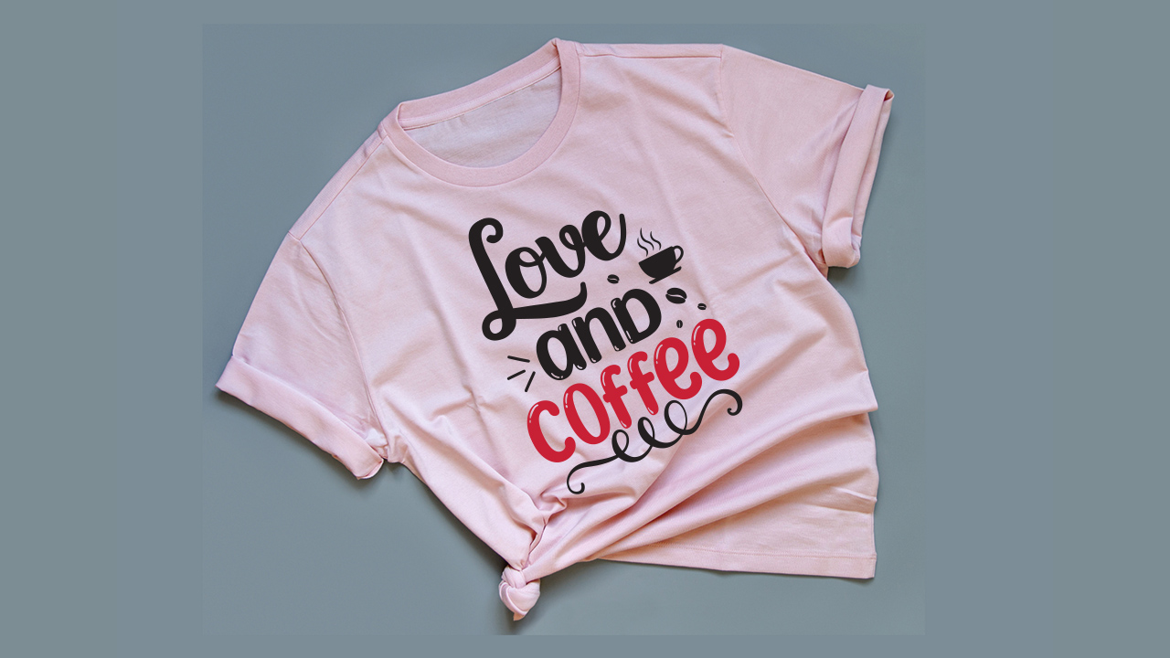 Black and red font on a pink t-shirt.