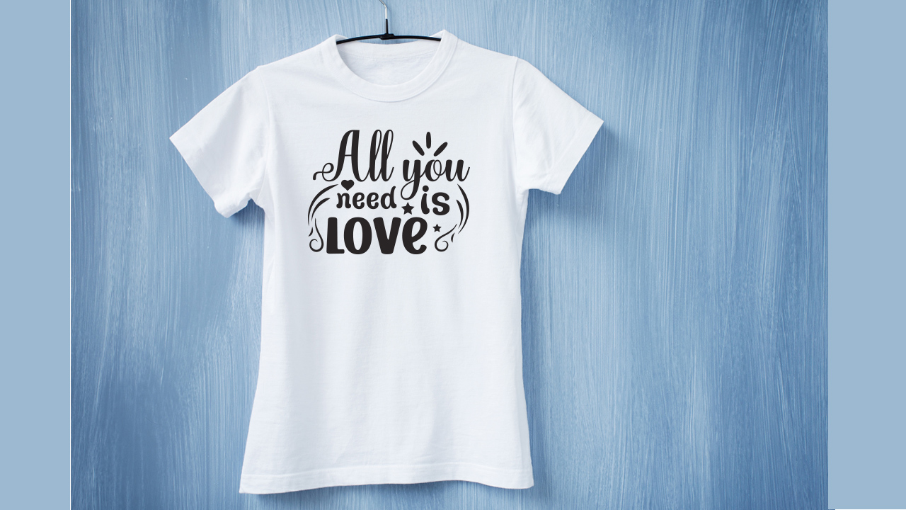 Black romantic lettering on a white t-shirt.