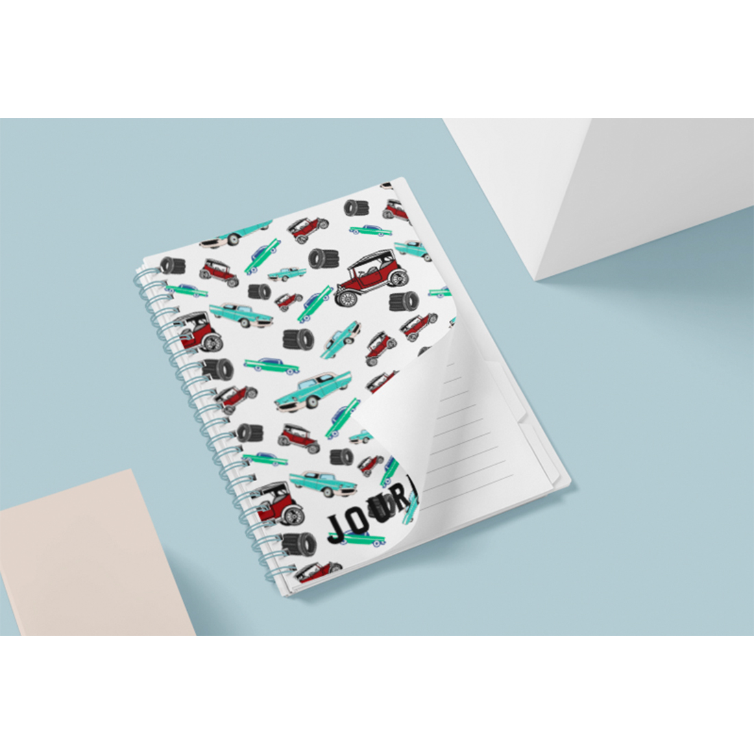 Light notebook with cars on a cover.