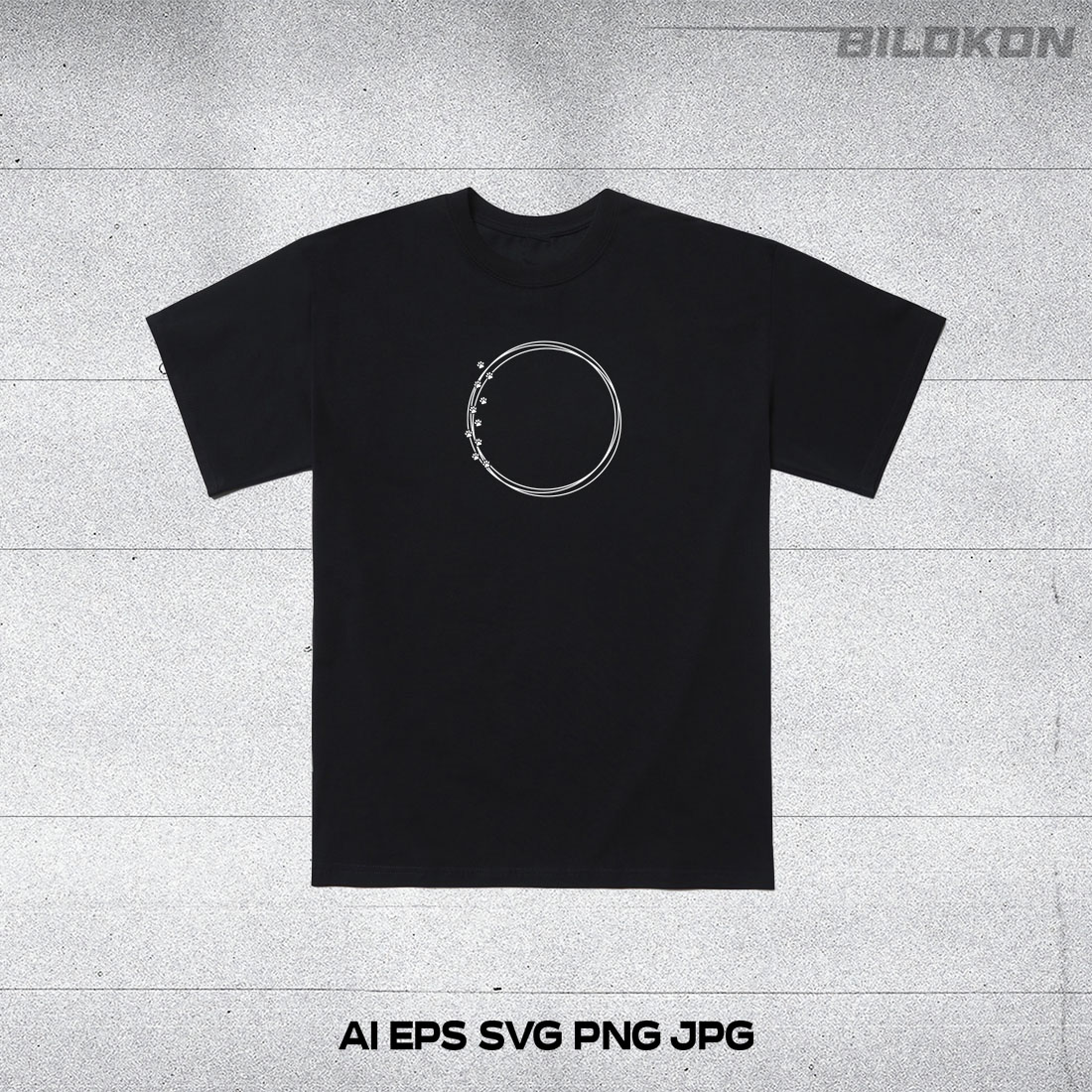 Black t - shirt with a silver circle on it.