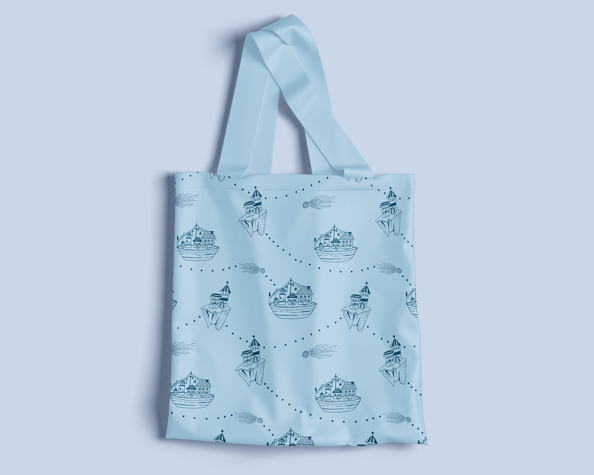 Blue mockup of shopping bag with sea illustration on a blue background.