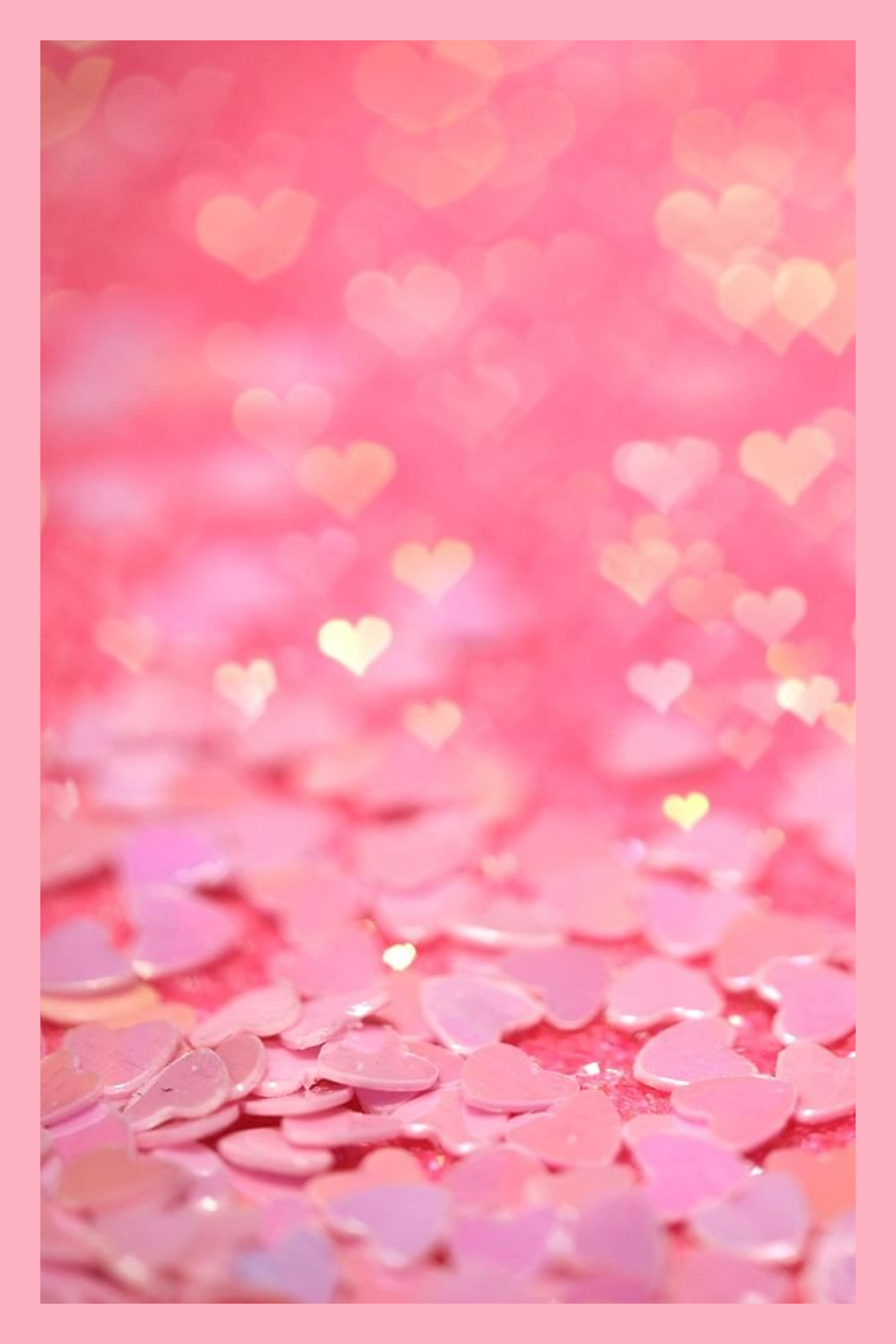 Photo of pink plastic hearts with bokeh effect.