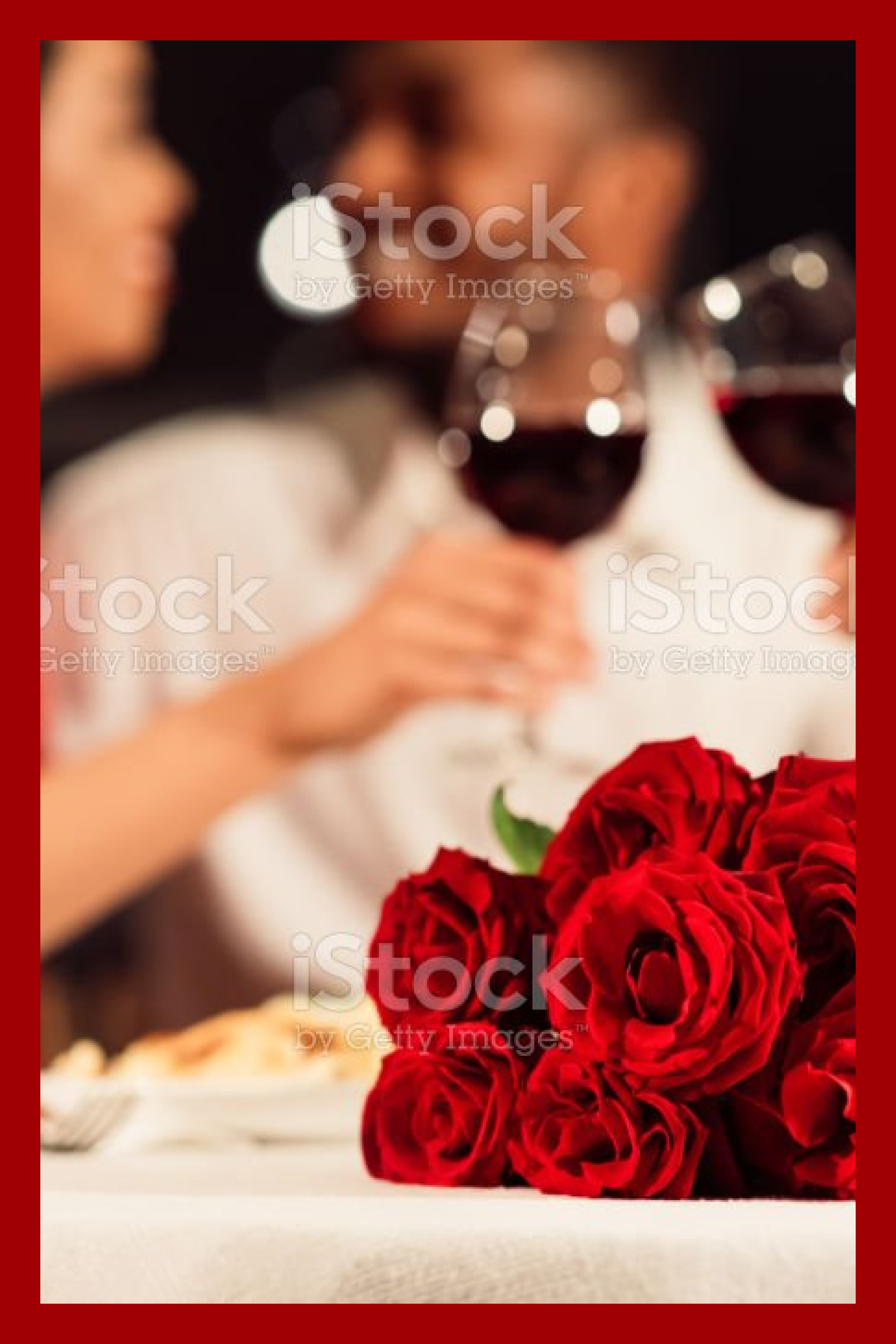 A high-quality photo of a couple in love with roses in the foreground..