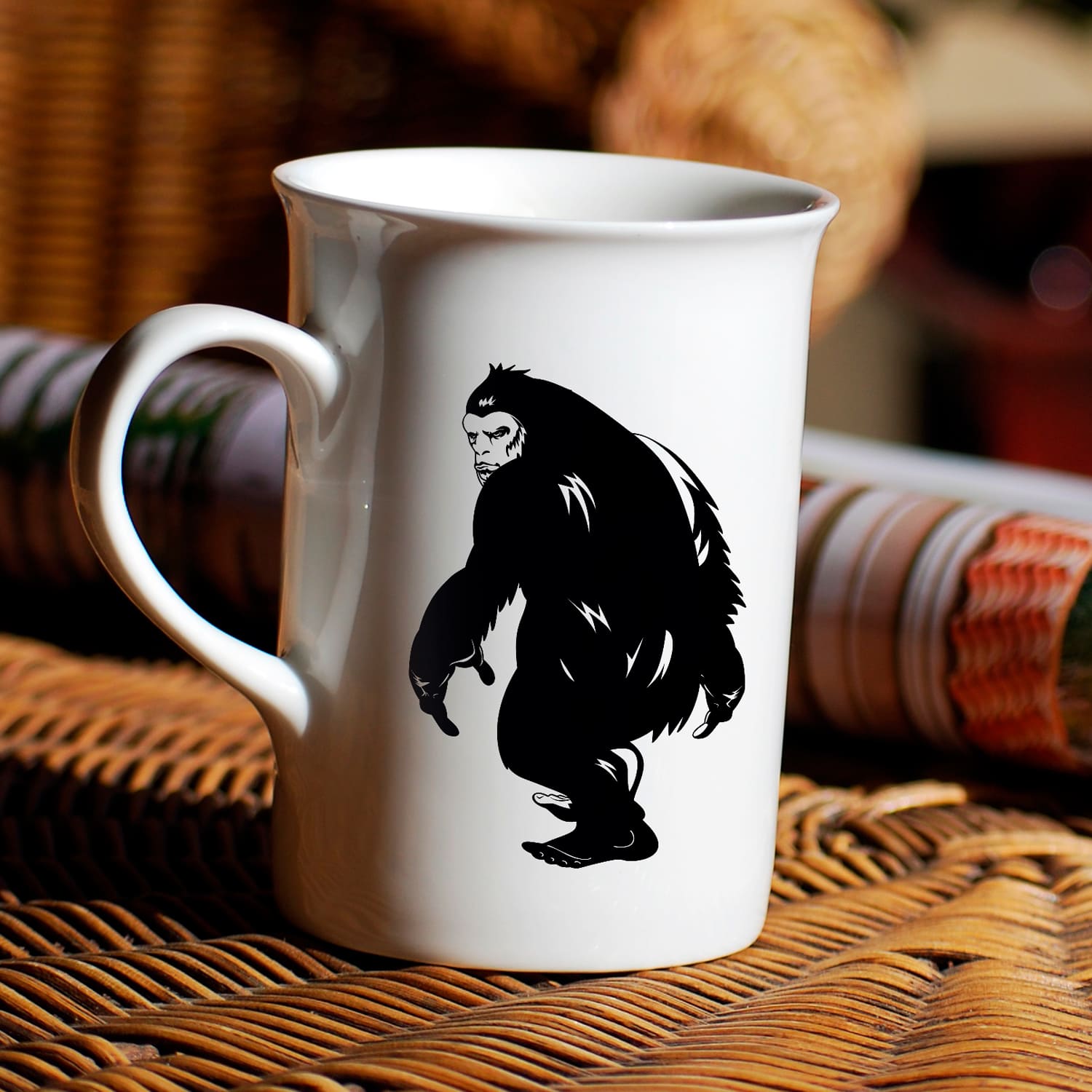 White coffee mug with a black gorilla on it.