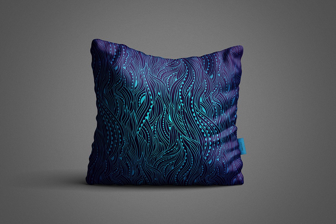 Square blue pillow with maritime seamless pattern.