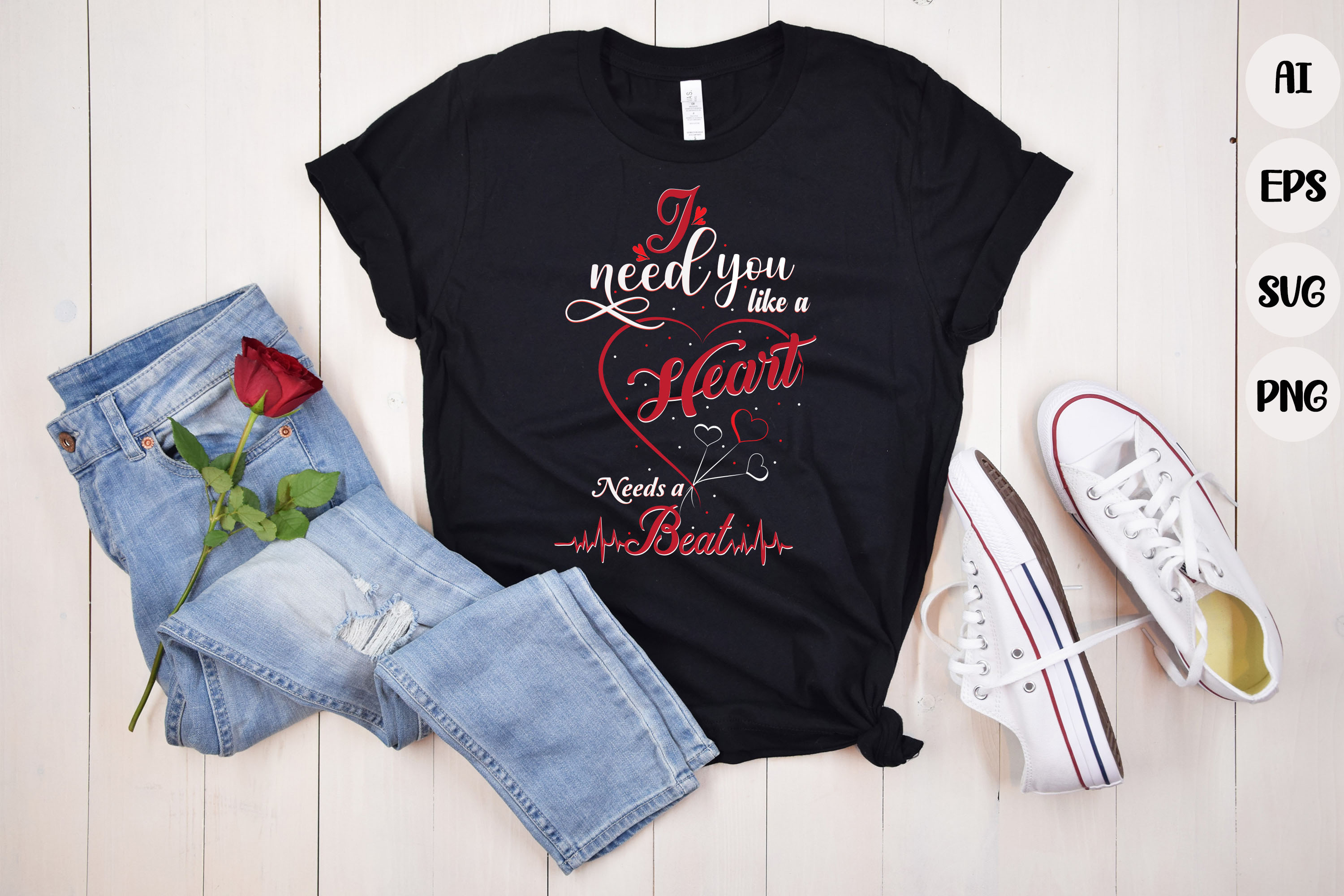 Image of a black t-shirt with irresistible inscription I need you like a heart needs a beat