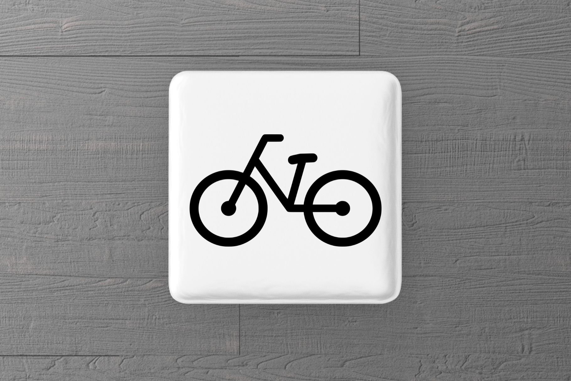 Grey background with a white bottom with a bicycle.