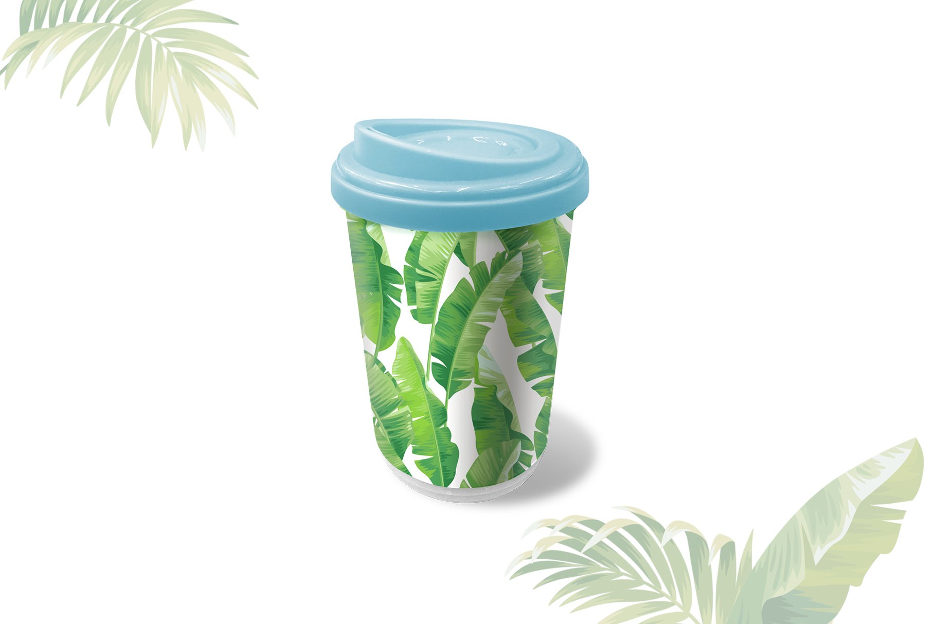 Cup with a blue lid and some green leaves.