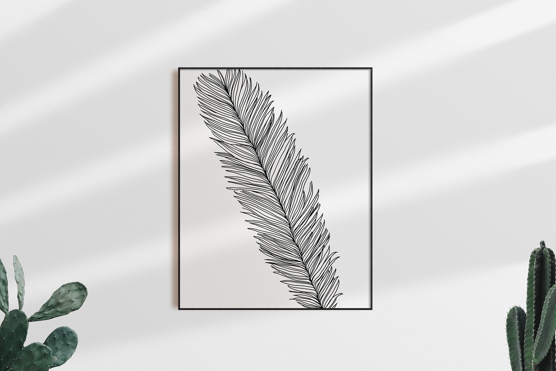 Black and white photo of a leaf in a frame.