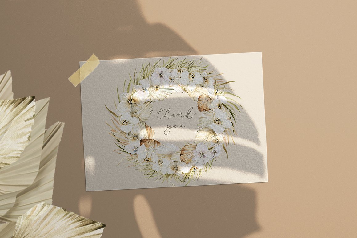 Card with a floral wreath on it.