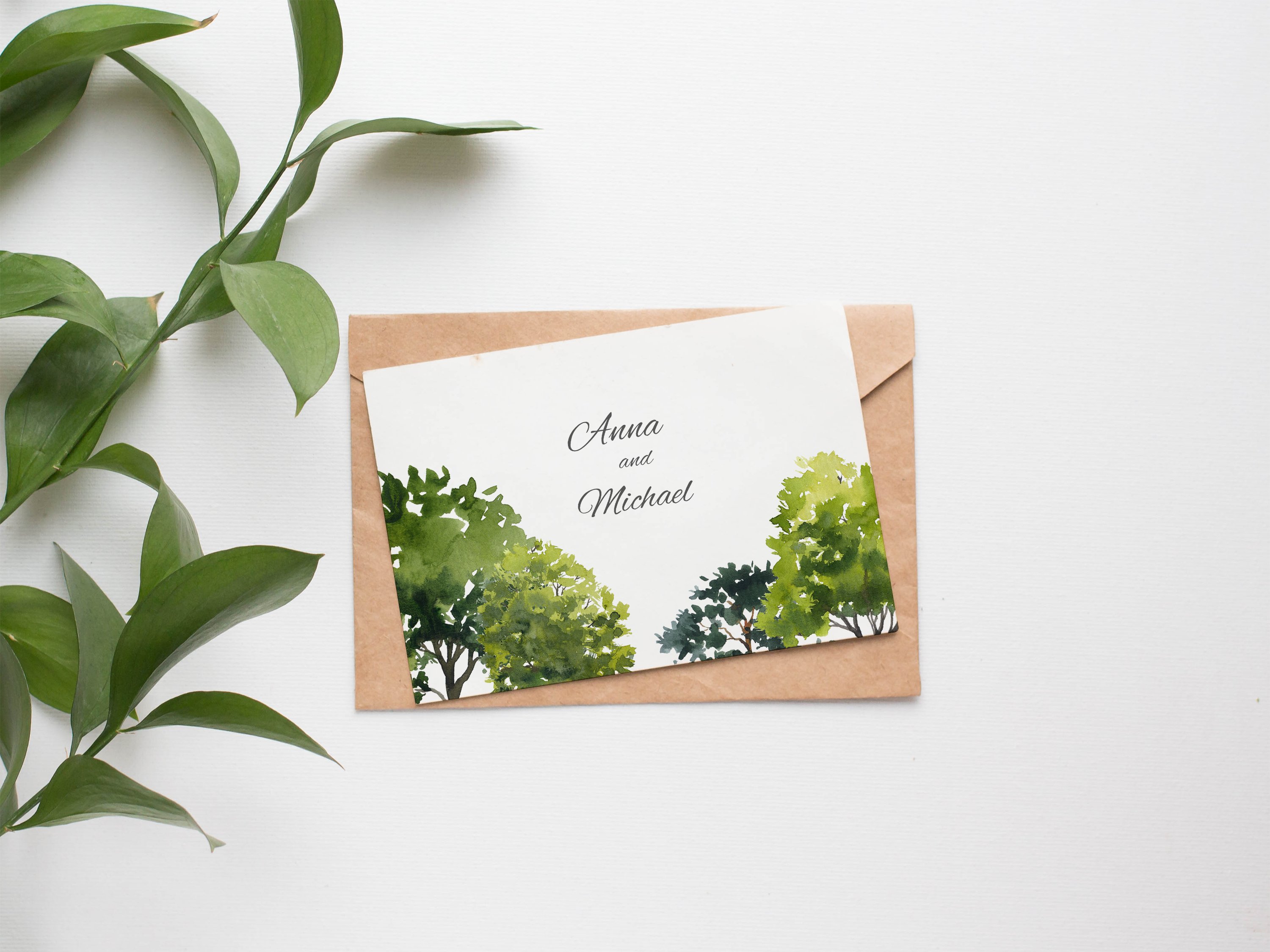Card with a watercolor painting of trees on it.