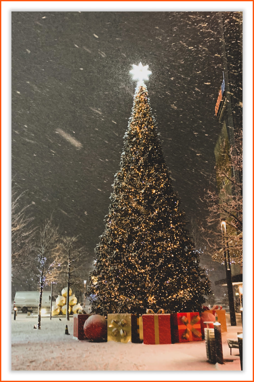 Photo of the a bright Christmas tree and big presents.