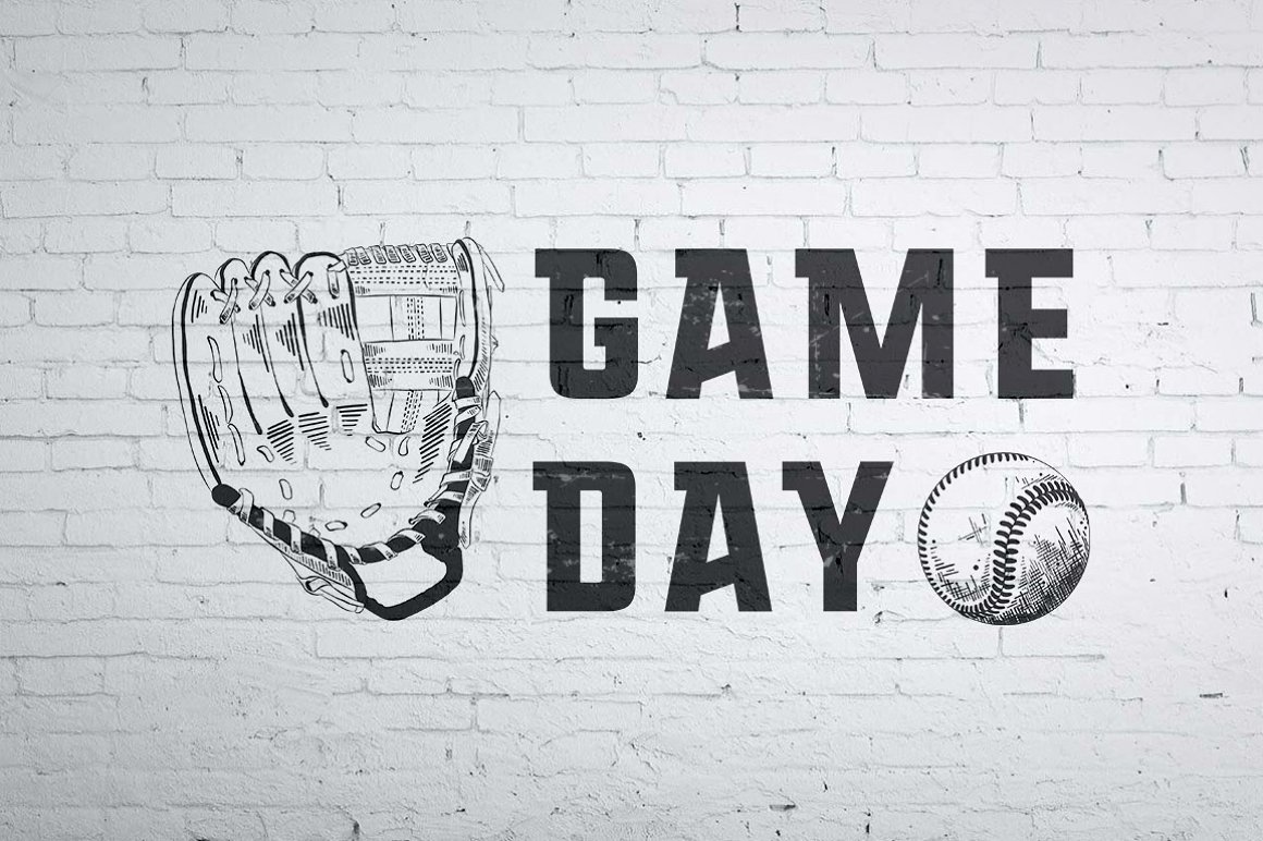 A white brick wall with a black and white drawing of a baseball glove and ball.