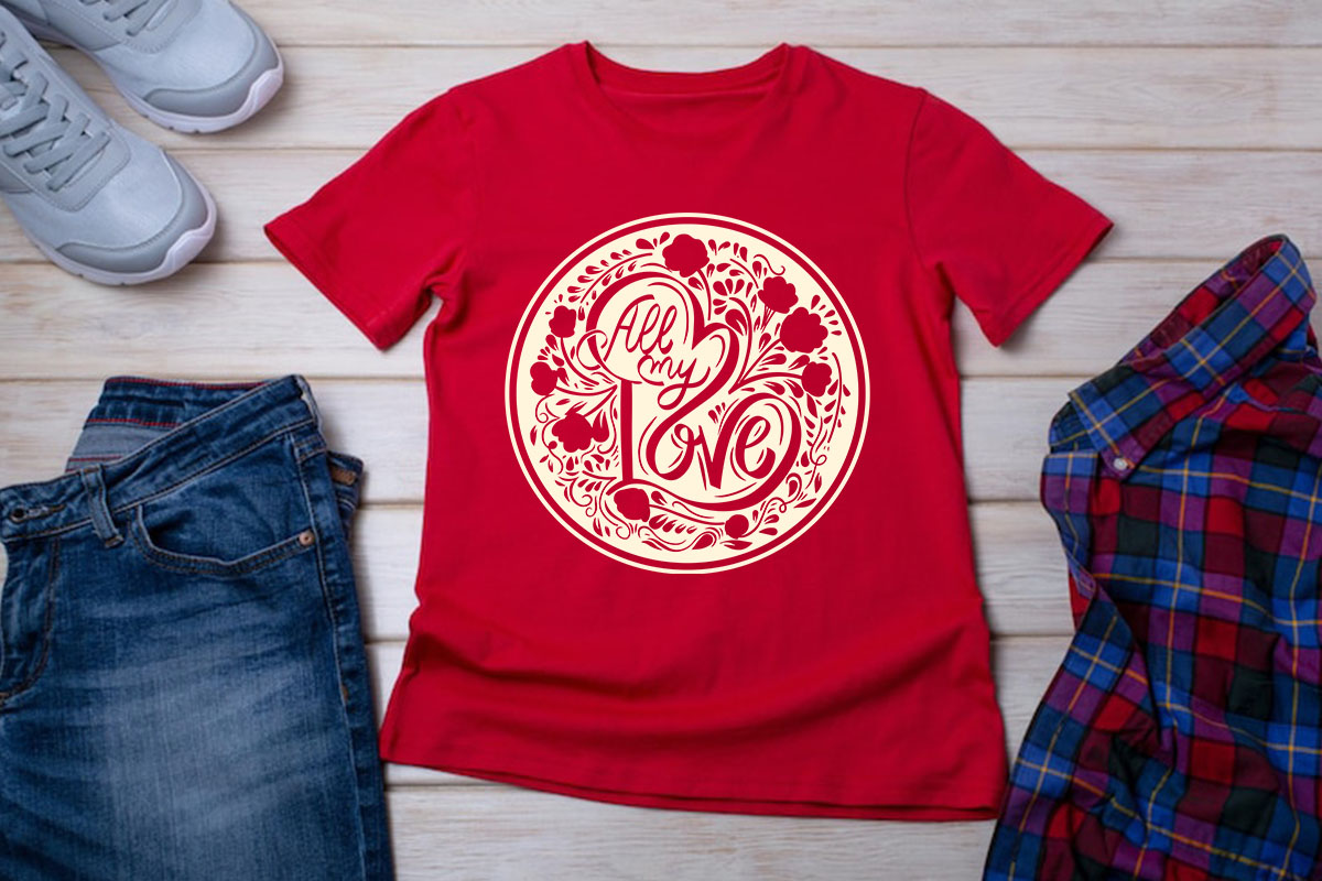 A red t - shirt with the word boo on it next to a pair of.