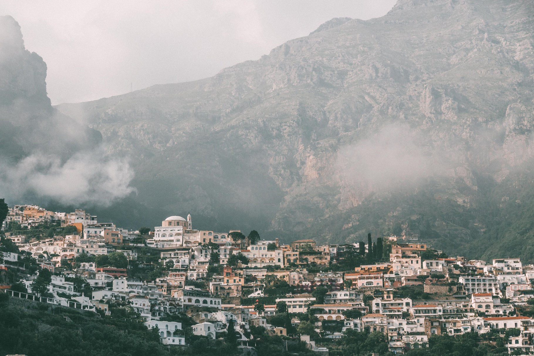 amalfi coast town with mountains behind 223