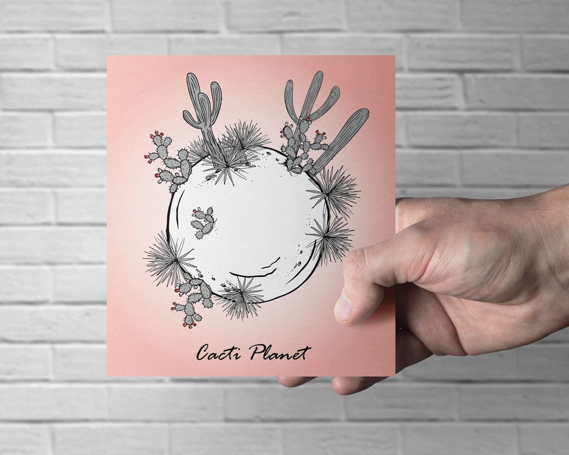 Hand holding a card with a picture of a plant.