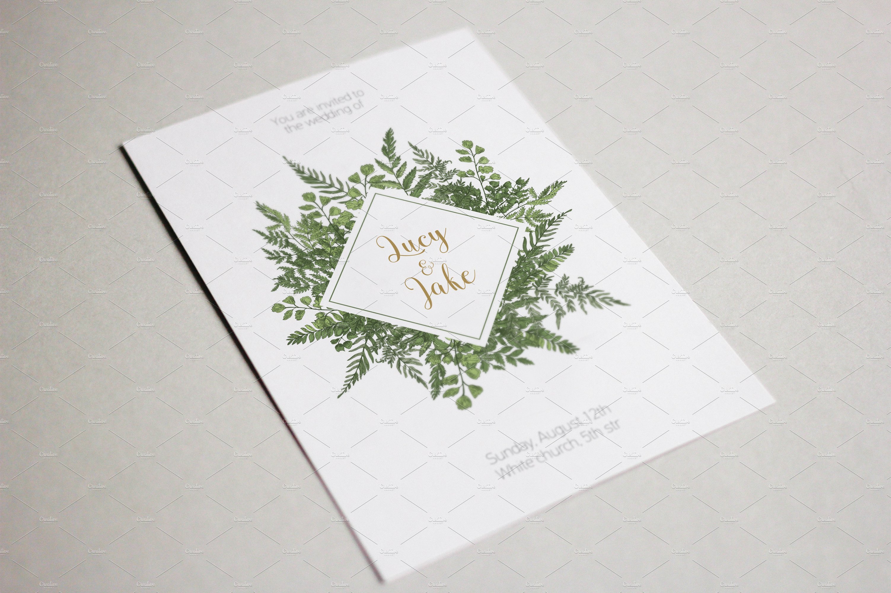 White card with a green wreath on it.