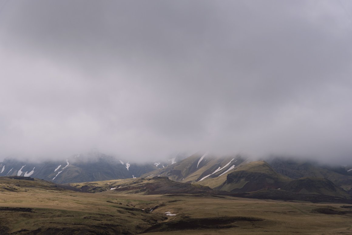 grey clouds over the hills 141