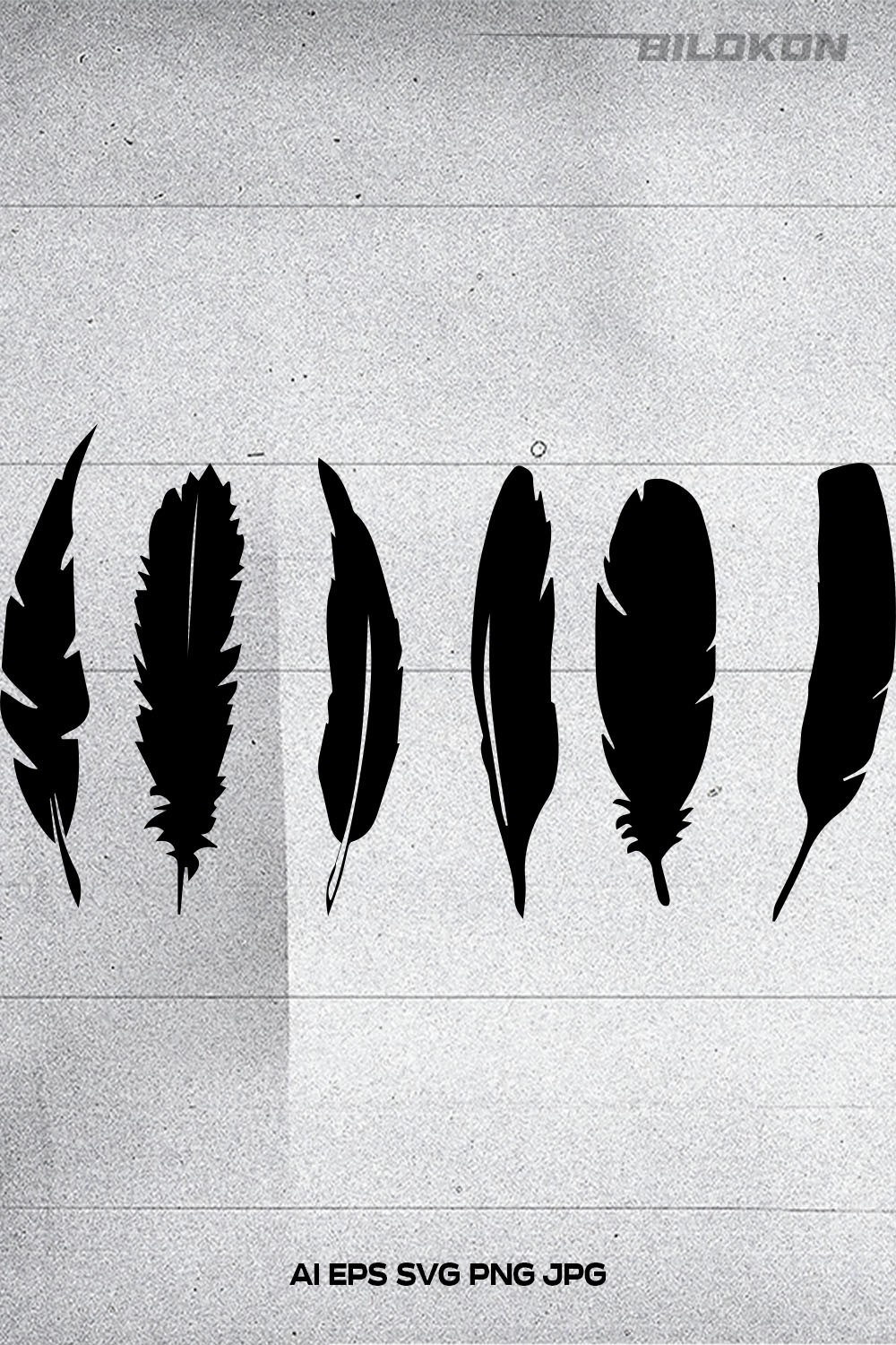 Group of black feathers sitting on top of a piece of paper.