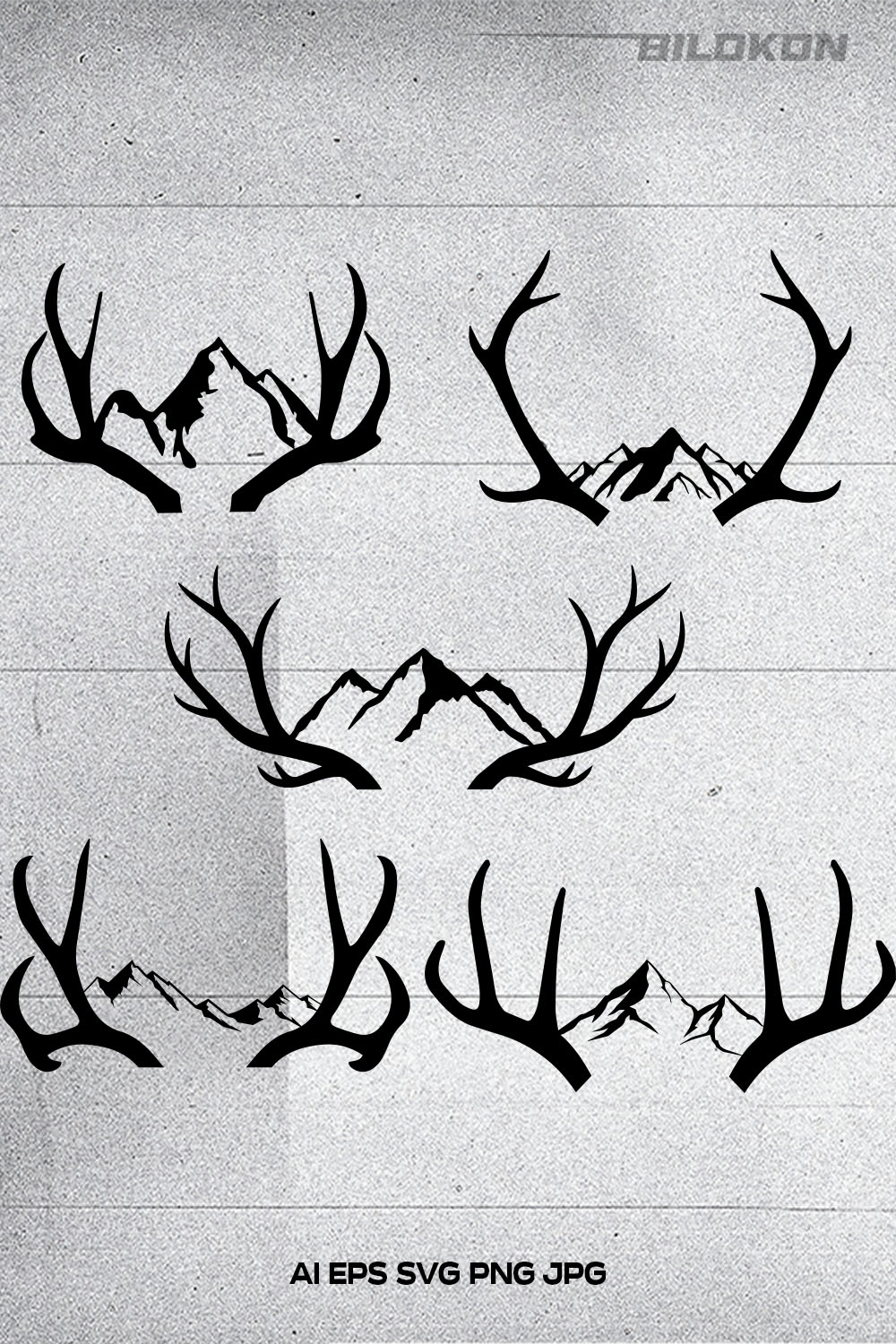 Bunch of deer antlers with mountains in the background.