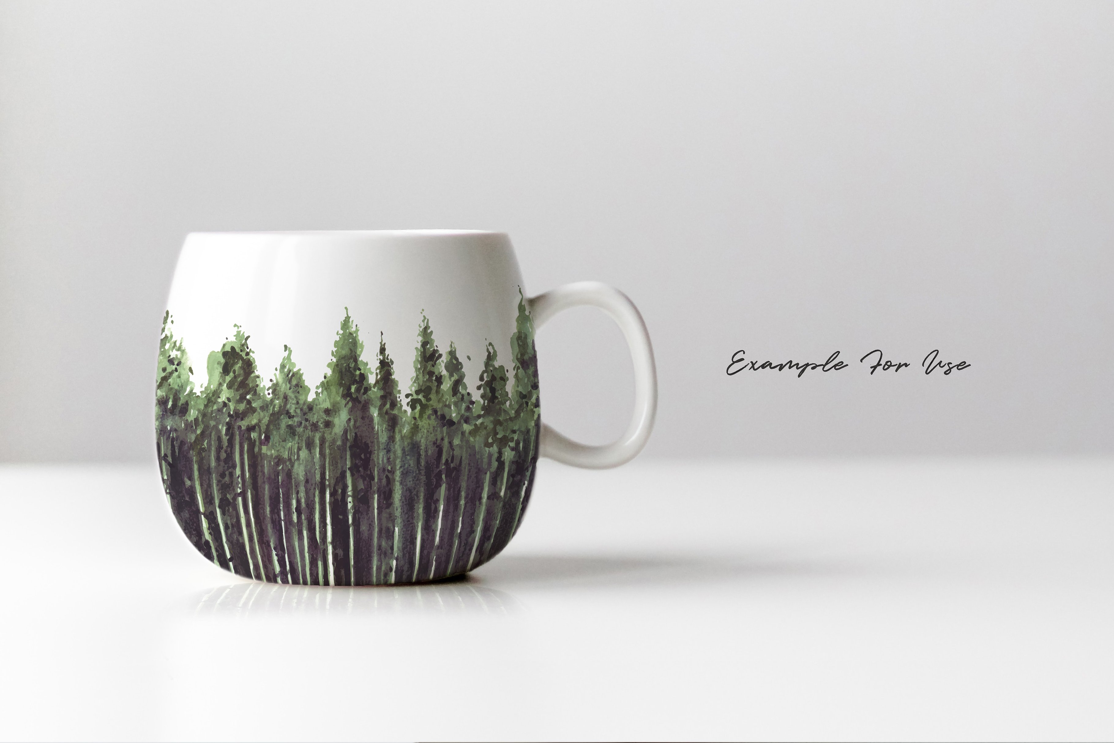 Coffee cup with a picture of a forest on it.