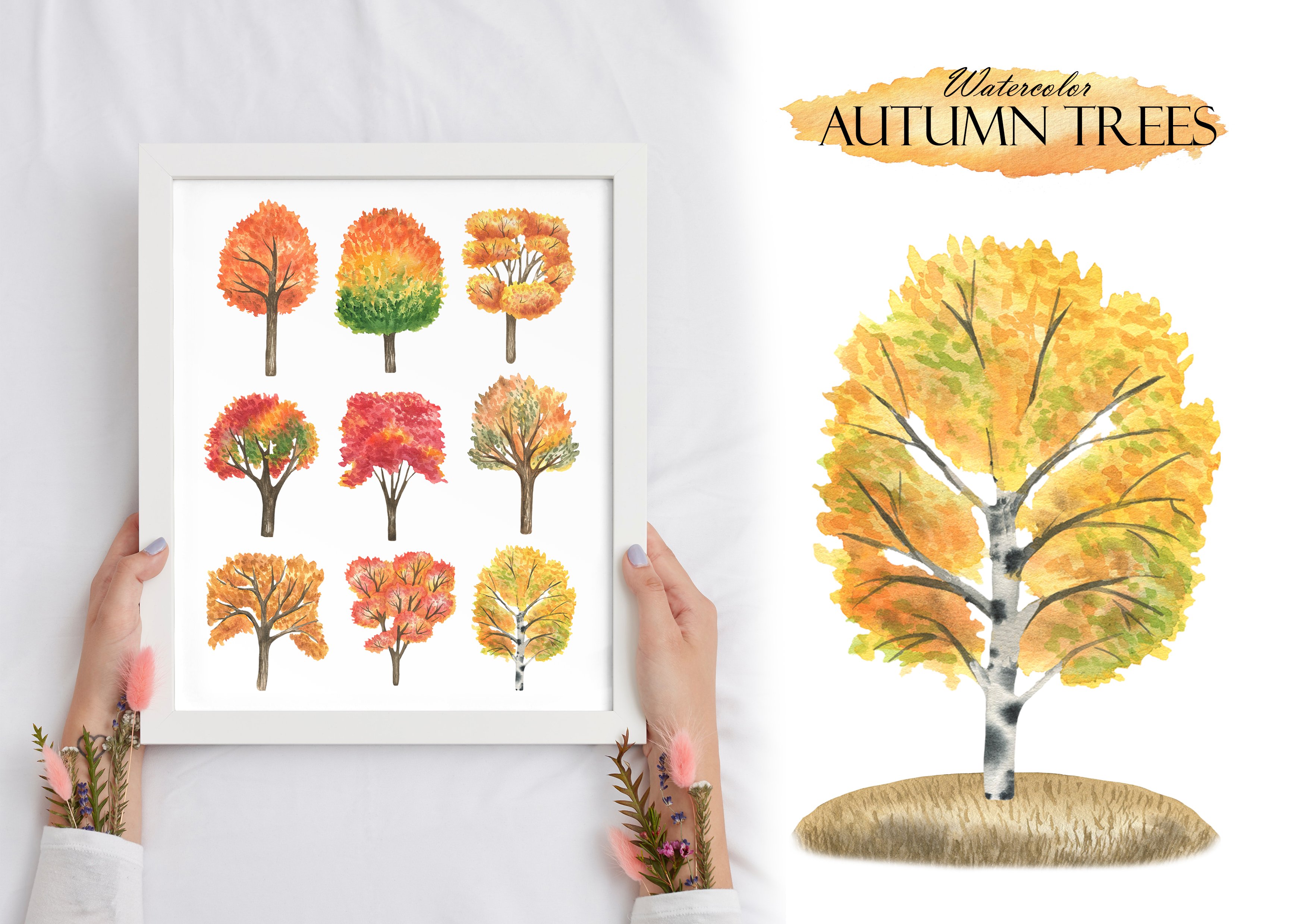 Woman holding a framed picture of autumn trees.