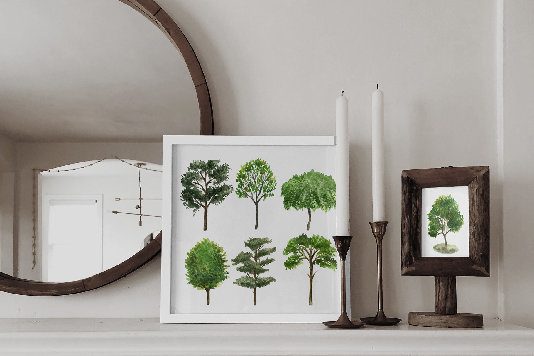White mantle with a mirror and a picture of trees.