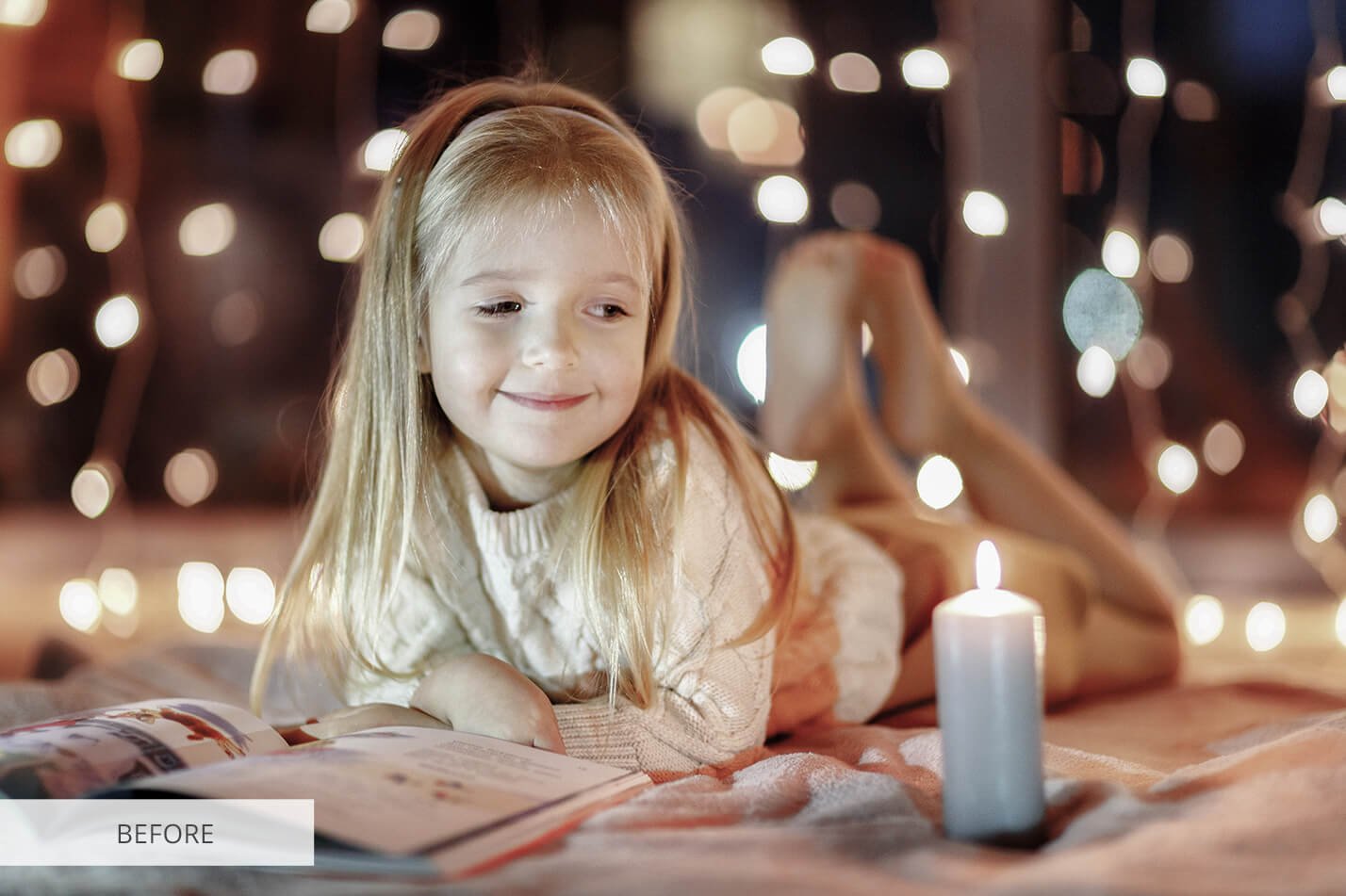 nominated cute little girl sitting at home in front of a book and candles christmas magic reading t20 3qppv7 824