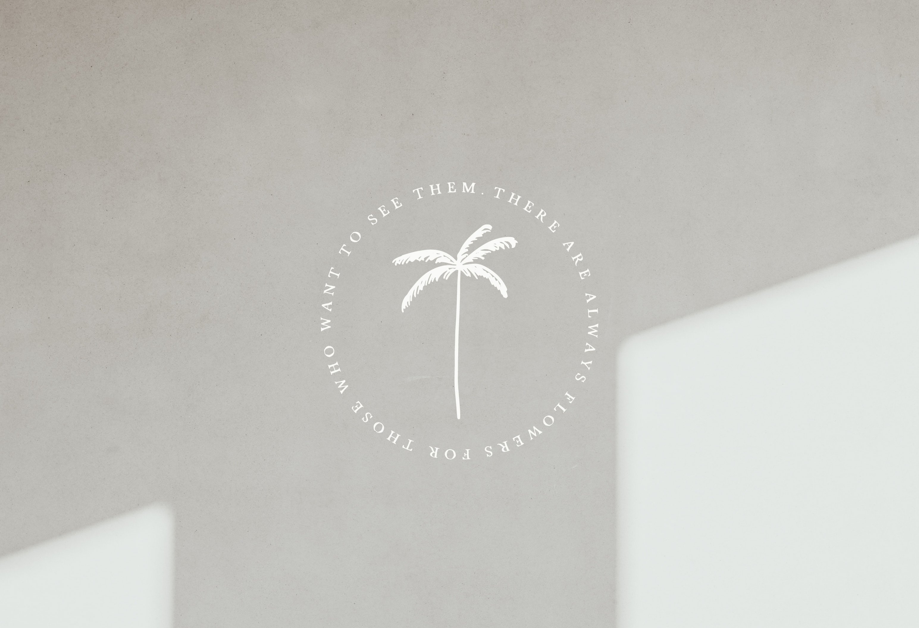White wall with a palm tree on it.