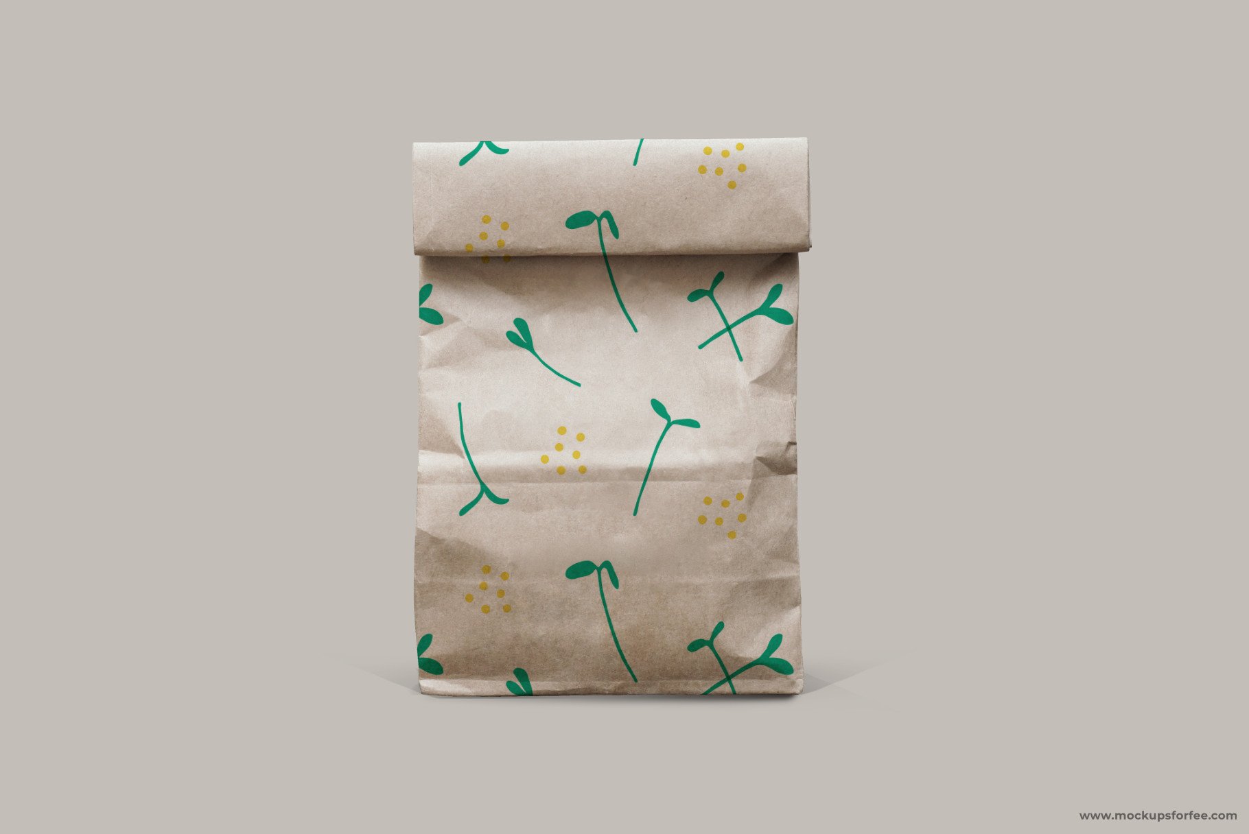 Brown paper bag with green dandelions on it.