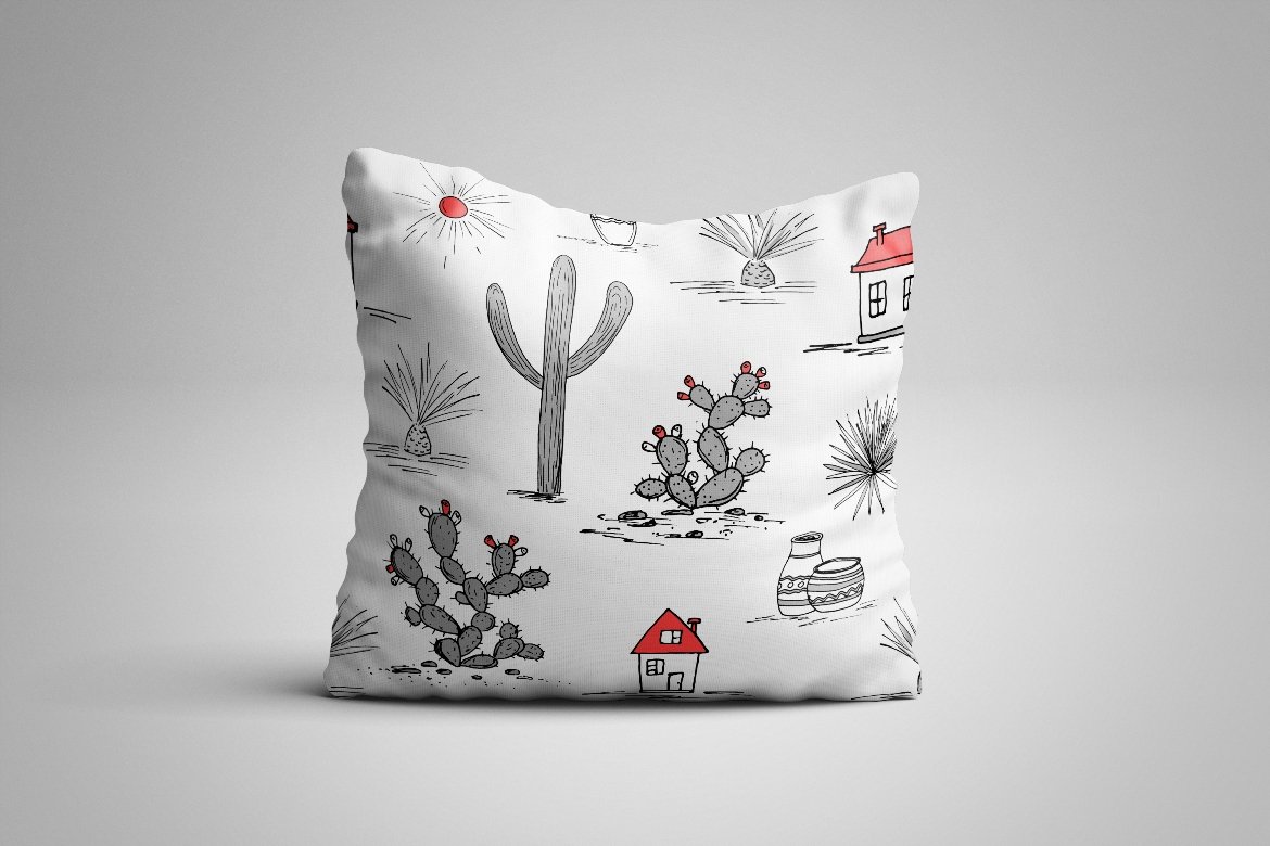 Pillow with a cactus pattern on it.