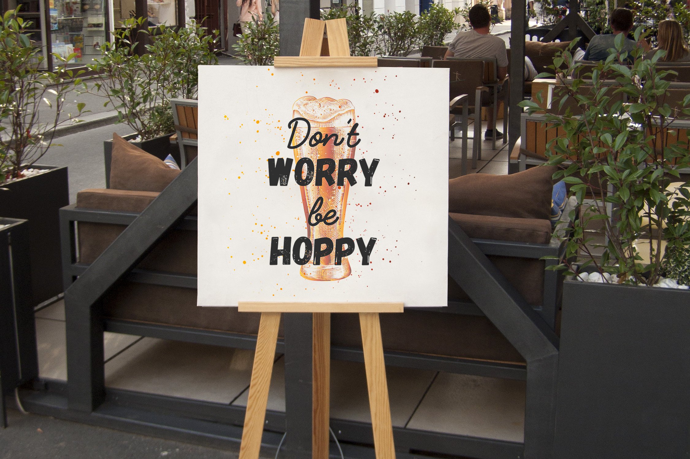 A sign on a easel that says don't worry be hoppy.