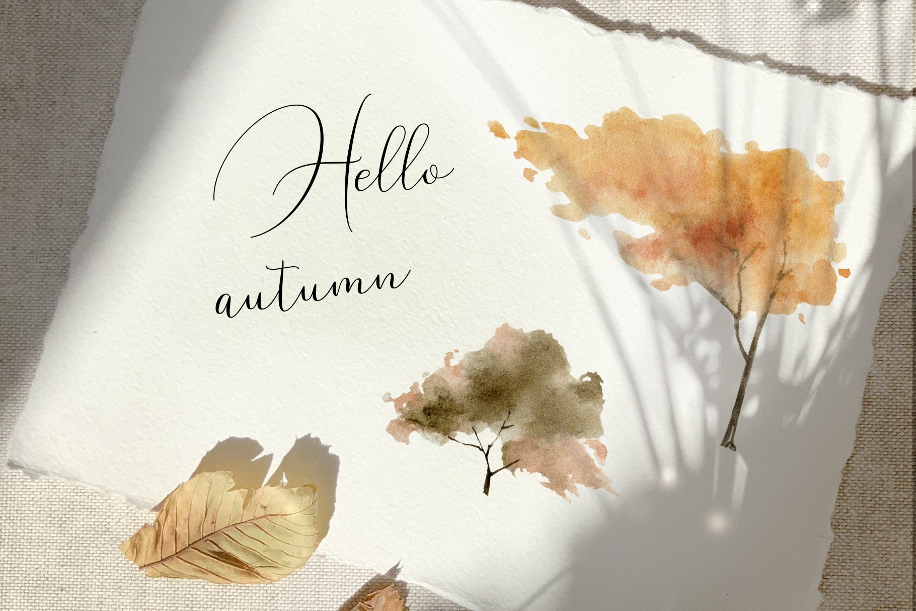 Watercolor painting of autumn leaves and the words hello autumn by Isobelle Ann Dods-Withers.